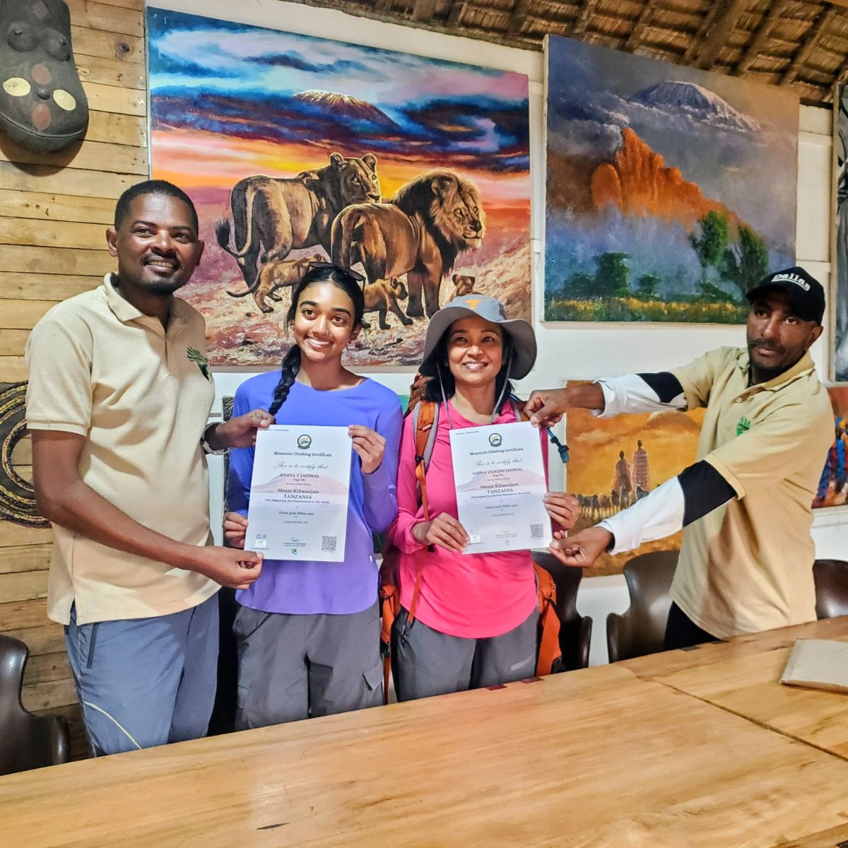 Happy clients at last day after climbing Kilimanjaro and receiving their certificates.