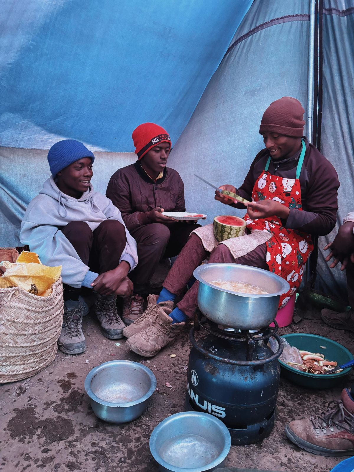 Mount kilimanjaro chef/cook preparing fruits for clients